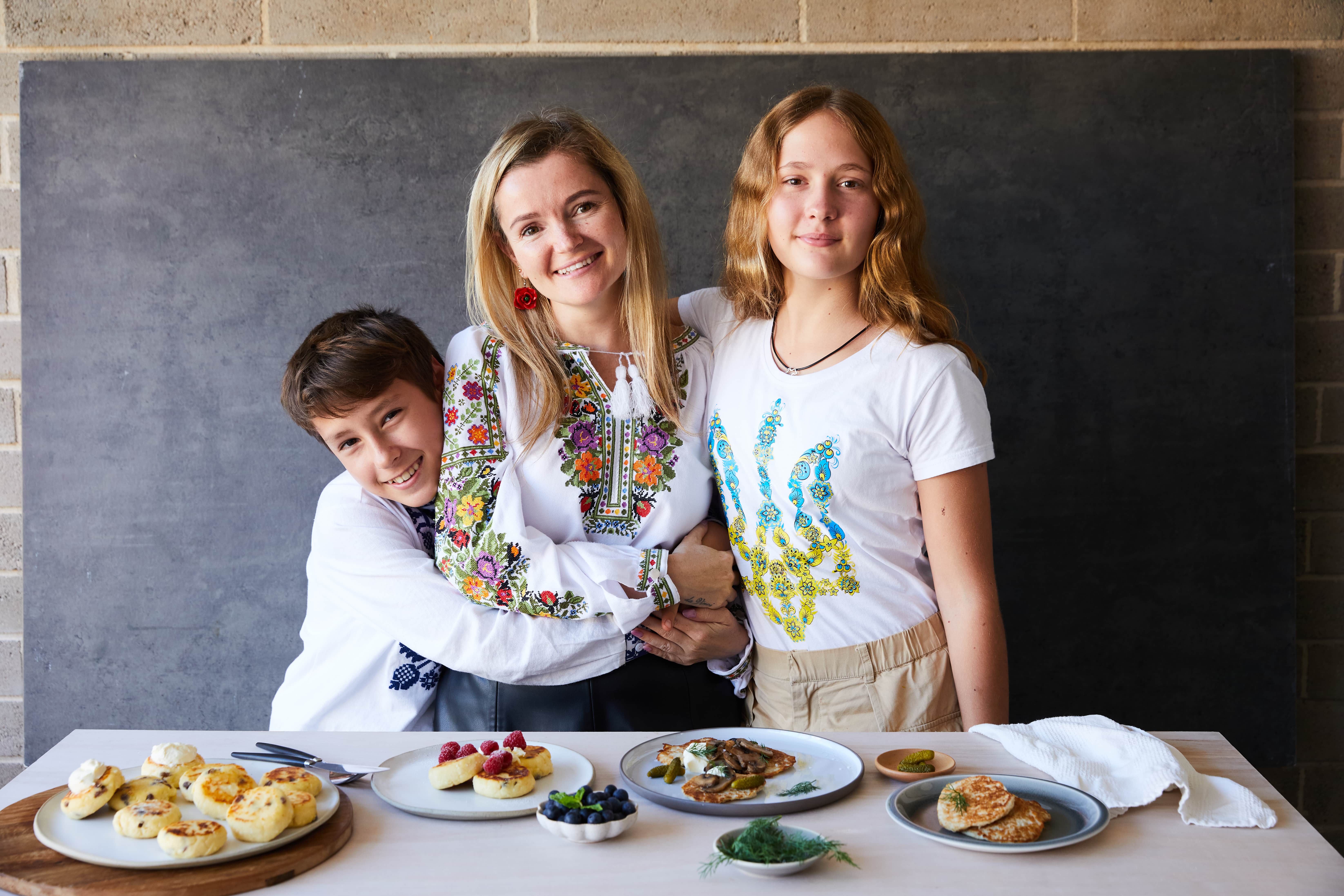 Displaced Ukrainian mother Mariia and her two children prepare Ukrainian pancakes 